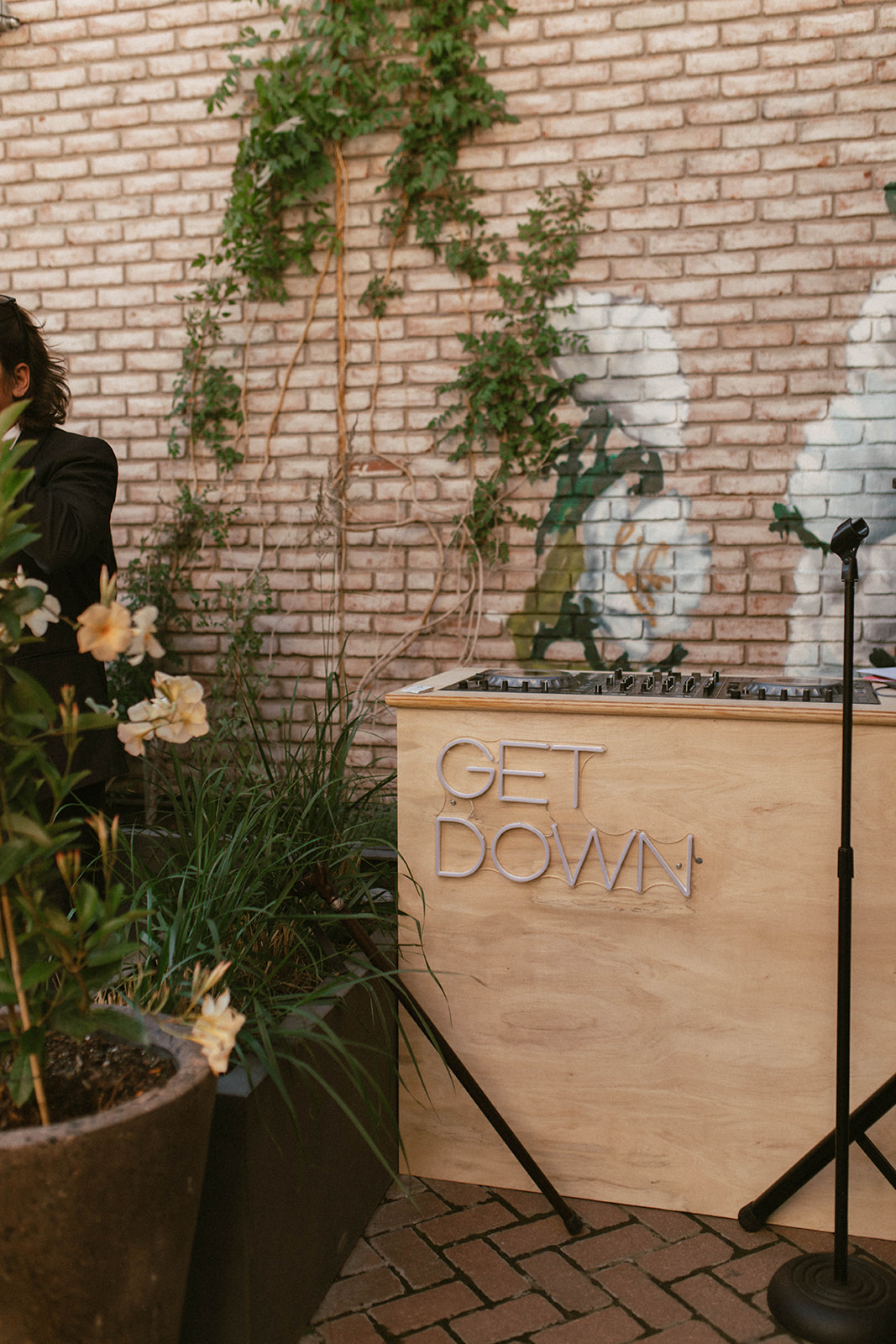 DJ booth with neon sign