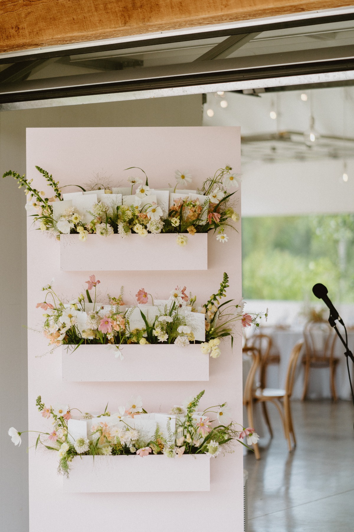 pink flower escort display for wedding