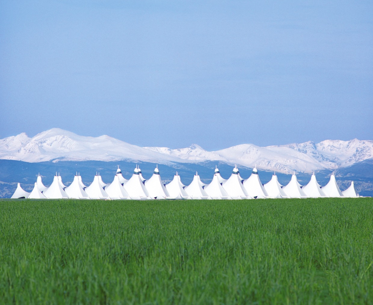 denver international airport with mountains in the background