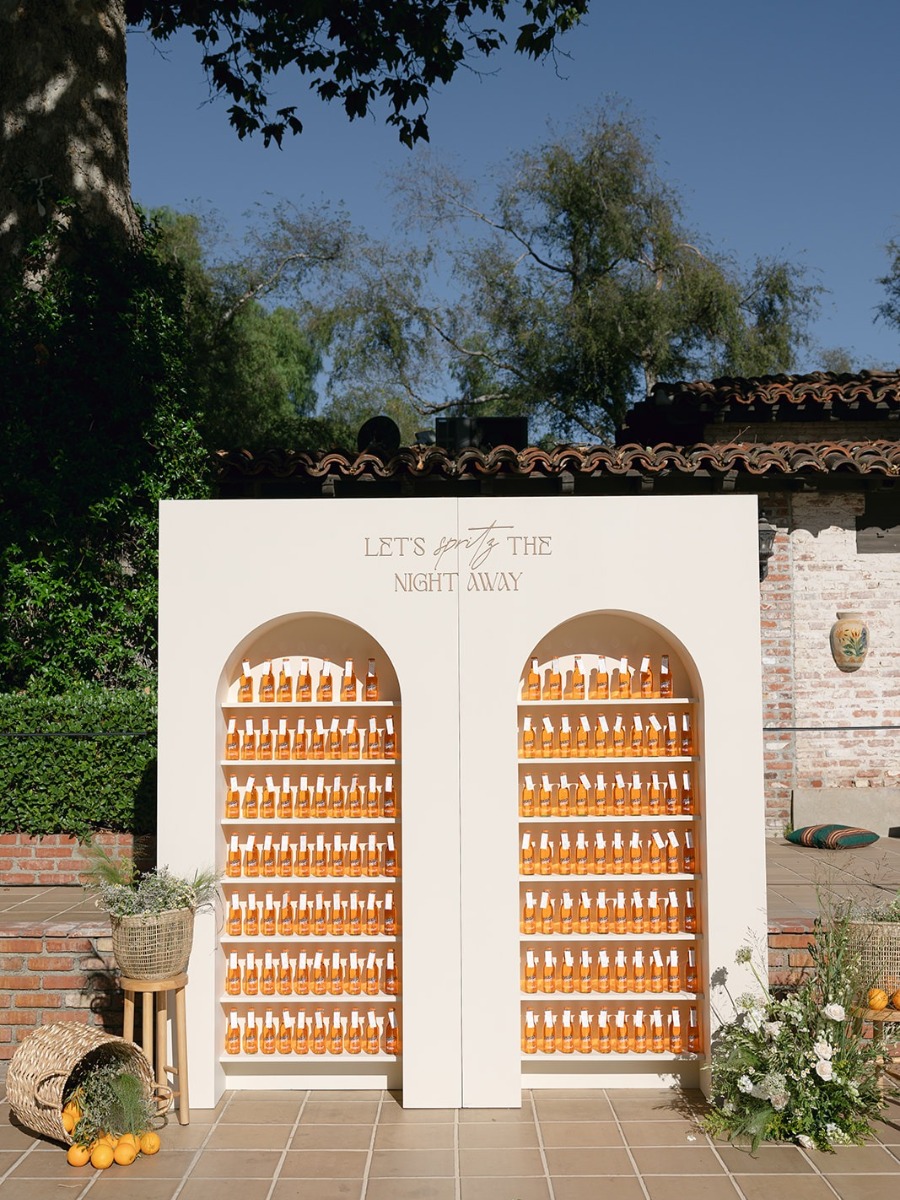 An al-fresco California wedding with the perfect Aperol escort wall