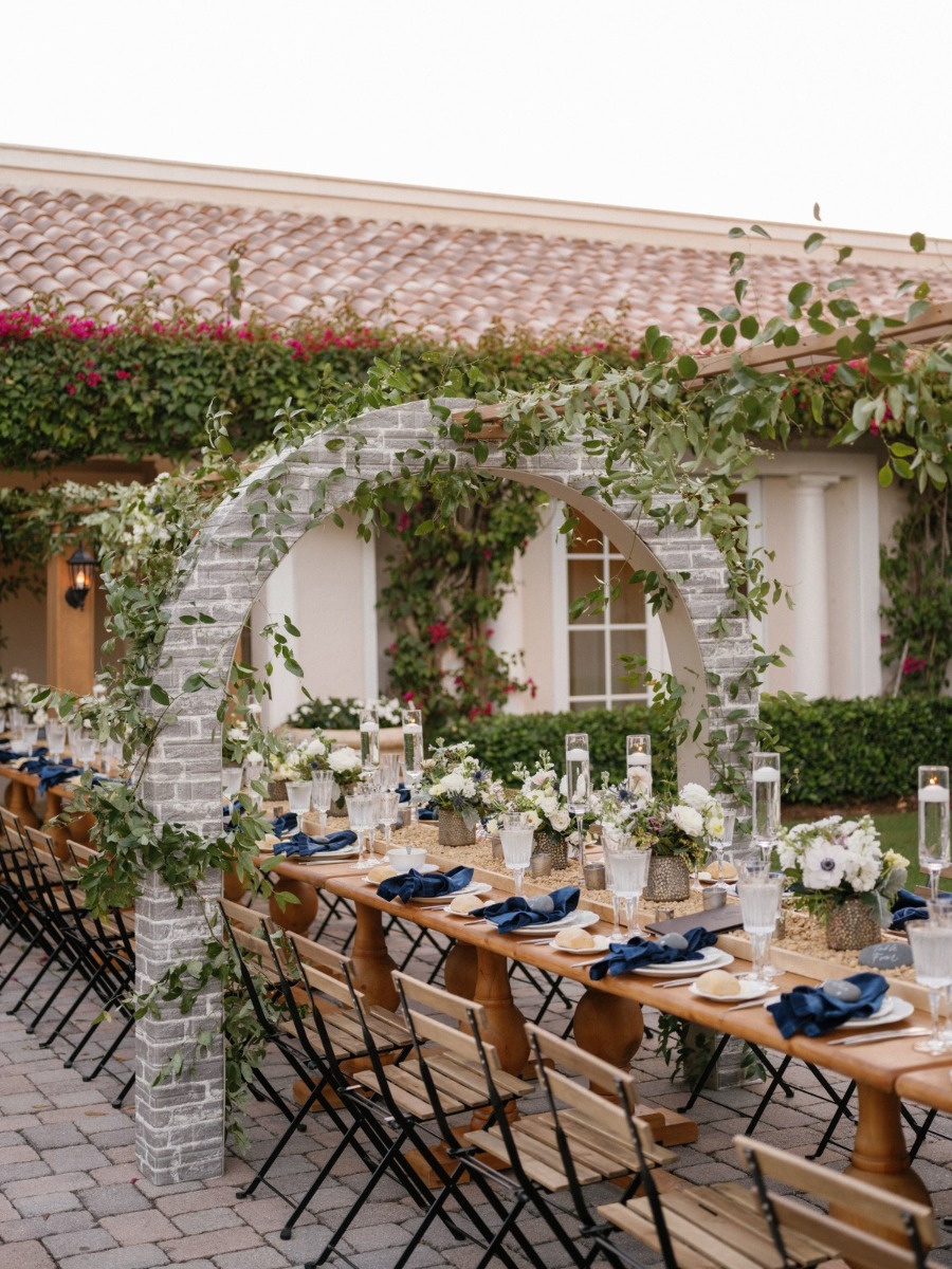 Tuscan-inspired wedding with a unique brick escort card display