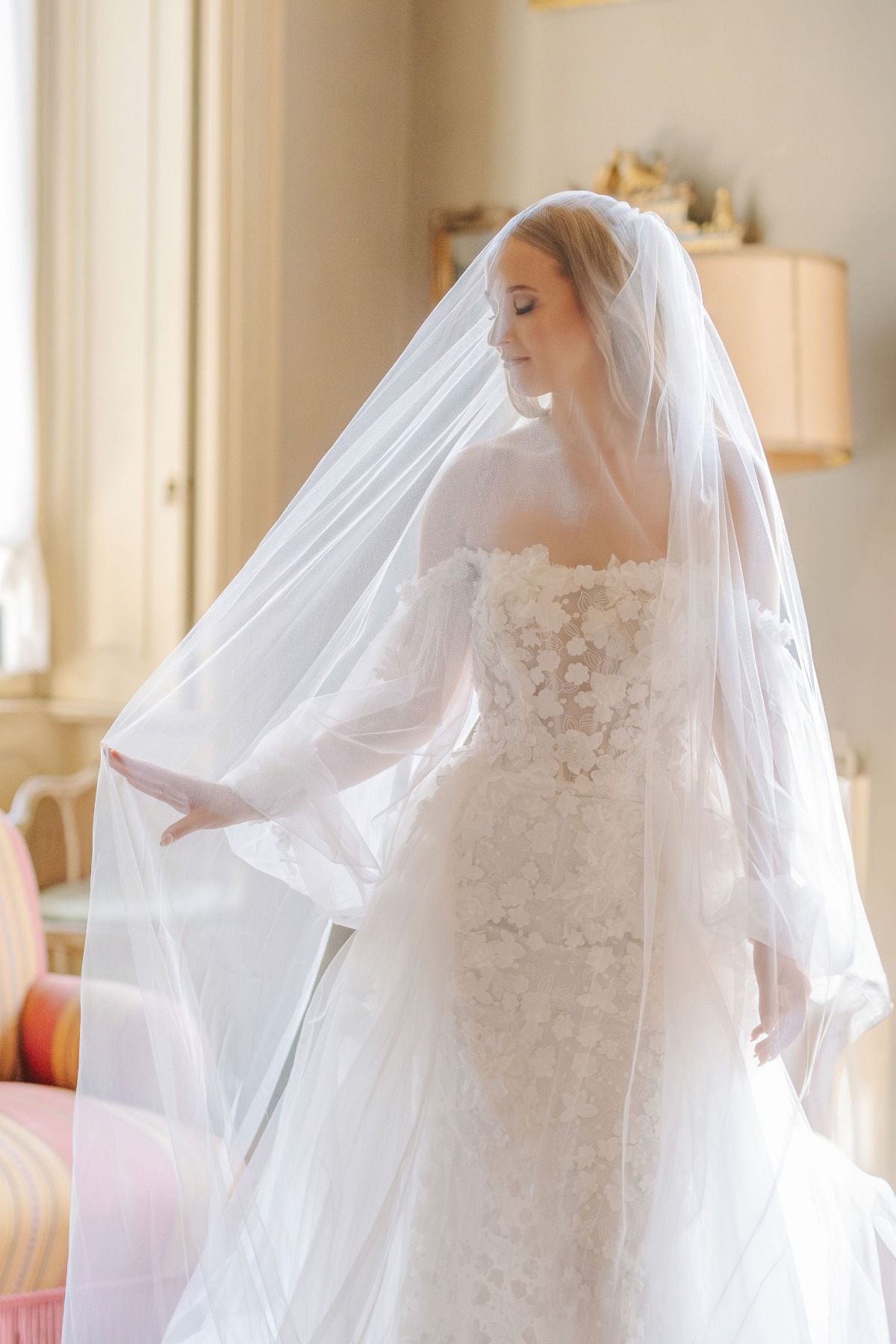 white lace wedding gown with veil and blusher