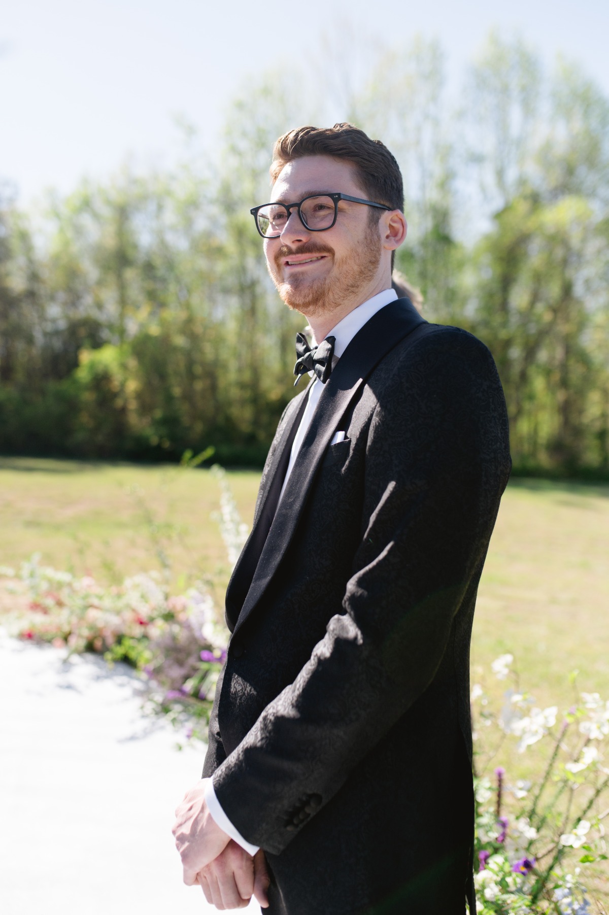 groom in jacquard tuxedo jacket